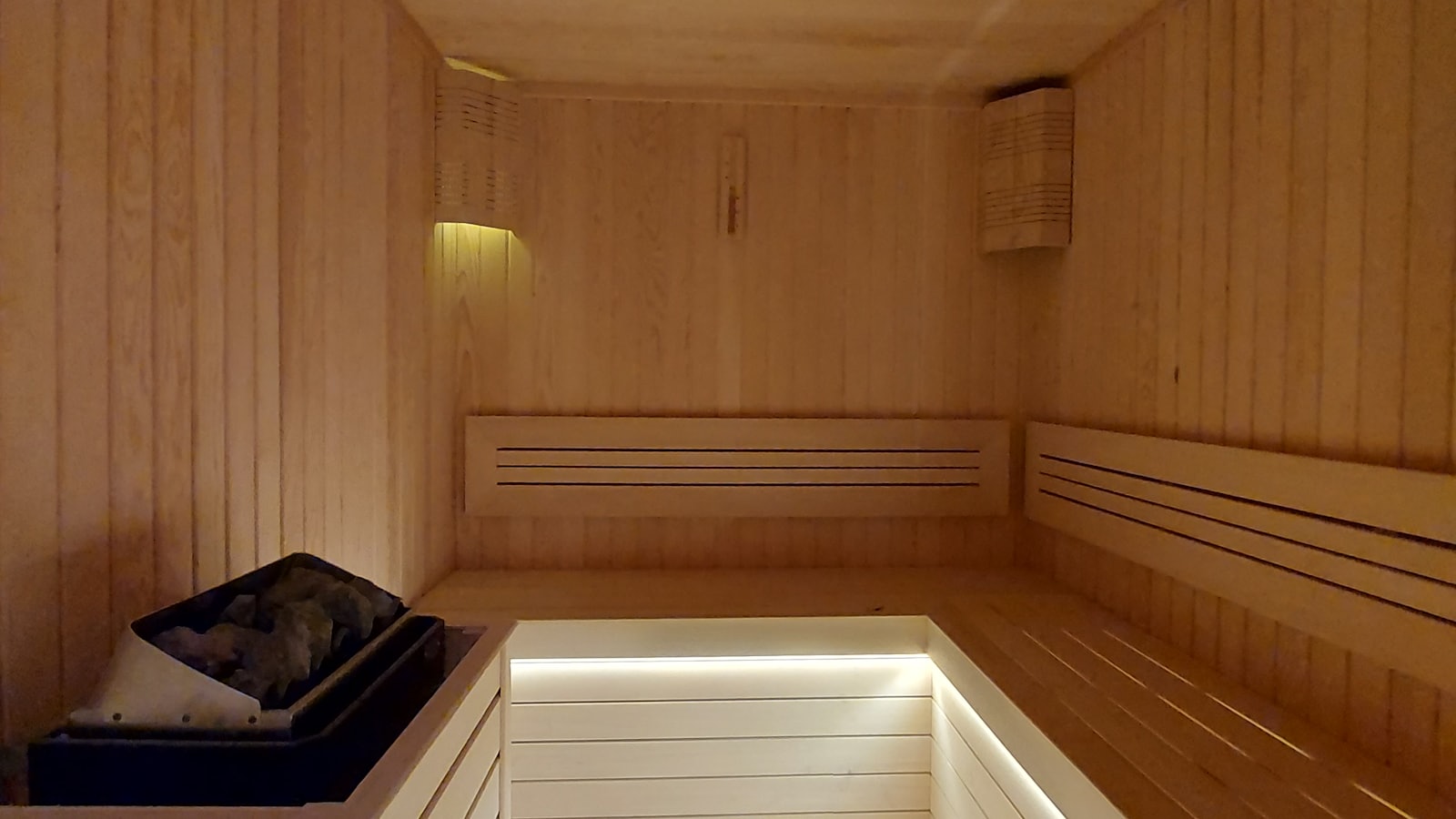 Warmly lit wooden sauna interior